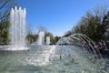 City fountain in the city of Krasnodar. People are walking by the fountain. Water splashes.