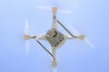 Drone DJI Phantom 4 in flight. Quadrocopter against the blue sky Royalty Free Stock Photo