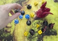 Playing dungeons and dragons game. Map with a figure of dragon and plastic figures of rpg characters Royalty Free Stock Photo