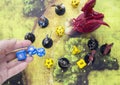 Playing dungeons and dragons game. Map with a figure of dragon and plastic figures of rpg characte Royalty Free Stock Photo