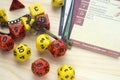 Playing Dungeons and Dragons, a role play game. Dices and cards lying on wooden surface. Deco Royalty Free Stock Photo