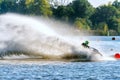 Jet ski racer drives watercraft making turn and splashing while racing at South Russian