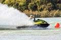 Jet ski racer drives watercraft making turn and splashing while racing at South Russian