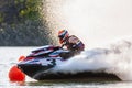 Jet ski racer drives watercraft making turn and splashing while racing at South Russian