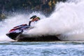Jet ski racer drives watercraft splashing in sunset while racing at South Russian Aquabike Royalty Free Stock Photo