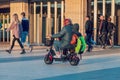 Krasnodar, Russia - October 21 2021: Modern people using electric scooter in city park.