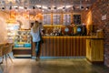 Krasnoyarsk, August 20, 2019: coffee shop DISCOVERY interior and decoration: a woman orders coffee from a Barista at the