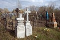 Ancient monuments with crosses among the graves at the old Troitsk cemetery 1842 in the city of Krasnoyarsk, in the spring.