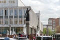 The fountain of Themis - the goddess of justice on the background of the Courthouse of the Krasnoyarsk Territory, on Prospekt Mira