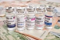 Covid Vaccine Vials - Photo on Money Banknotes