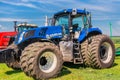 Krasnoyarsk, Russia - July 2, 2021: Powerful New Holland tractor on an agricultural field