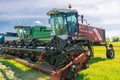Krasnoyarsk, Russia - July 2, 2021: Tractor Rostselmash KSU with a mower on an agricultural field