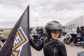 Krasnoyarsk, Russia - May 16, 2020: Harley Davidson free ride outdoor. Biker girl with helmet standing