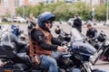 Krasnoyarsk, Russia - May 16, 2020: Harley Davidson outdoor. Biker man sitting on motorcycle.