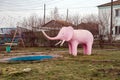 Fountain `Pink Elephant` in the same square in the Uzhur, of Krasnoyarsk Territory, Russia.