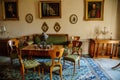 Krasny Dvur Chateau, North Bohemia, Czech Republic, 19 June 2021: Castle interior, Biedermeier furniture in living room table with