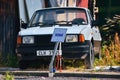 Kravare, Machuv kraj, Czech republic - July 14, 2018: abandoned czechoslovak car Skoda 120L from 80`s and mark stand between hous