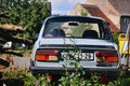 Kravare, Machuv kraj, Czech republic - July 14, 2018: abandoned czechoslovak car Skoda 120L from 80`s stand between houses on end