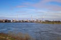 View over river rhine on  industrial area with factories and chimneys against blue sky Royalty Free Stock Photo