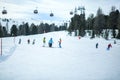 KREISCHBERG, MURAU, AUSTRIA - MARCH 15, 2017: Many skiers ride in Alps at sunny winter day. Cable car in mountains Royalty Free Stock Photo