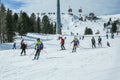 KREISCHBERG, MURAU, AUSTRIA - MARCH 15, 2017: Many skiers ride in Alps at sunny winter day. Cable car in mountains Royalty Free Stock Photo