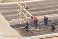 Kremenchug, Poltava region, Ukraine, April, 2019, repair of the old roof of the building, the roof is covered with new ruberoid Royalty Free Stock Photo