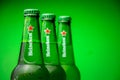 Cold bottle of Heineken Lager Beer on green background Royalty Free Stock Photo