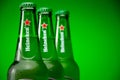 Cold bottle of Heineken Lager Beer on green background Royalty Free Stock Photo