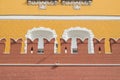 Brick Kremlin wall with battlements and yellow Arsenal building Royalty Free Stock Photo