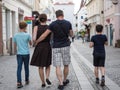 KREMS AN DER DONAU, AUSTRIA - 05/25/2019: Family with two kids walking on street