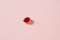 Krill oil pill on pastel pink background - source of omega 3
