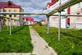 Kriov, Russi - September 08, 2019: Street in a small town, green lawn and houses in a summer Royalty Free Stock Photo