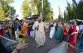 Krishna guru preaching with microphone standing among crowd of followers, fest camp. Festival Vedalife. Kyiv, Ukraine Royalty Free Stock Photo