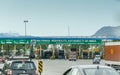 Queued vehicles waiting to cross toll plaza in india, interstate highway transportation