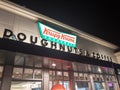 Krispy Kreme Doughnuts storefront at night