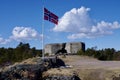 Norwegian Flag over Kristiansand Cannon Museum. Kristiansand, Norway. April 7, 2014. Royalty Free Stock Photo