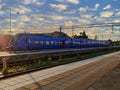 Kristianstad, Sweden - August, 2021: purple train from Skanetrafiken arrive or depart at the station area in the city terminal. St