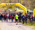 Krivoy Rog, Ukraine - 21 April, 2019: Group of young athletes in start position. Fit young people preparing for Marathon