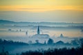 Krizevci cathedral in fog landscape Royalty Free Stock Photo