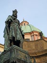 Emperor Charles IV Statue and green copper dome of the St Francis of Assisi Church Prague Old Town Royalty Free Stock Photo