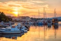 Krk, the largest town on the Krk island, Kvarner bay, Croatia. Scenic view of the harbor, embankment and Krk cathedral at sunrise Royalty Free Stock Photo