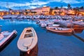 Krk. Town of Malinska waterfront and harbor dawn view Royalty Free Stock Photo