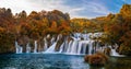 Krka, Croatia - Panoramic view of the famous Krka Waterfalls in Krka National Park on bright autumn morning with colorful foliage Royalty Free Stock Photo