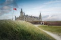 Kronborg Castle and the flag of Denmark known as Dannebrog - Helsingor, Denmark Royalty Free Stock Photo