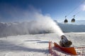 Kronplatz Italy, 30th december 2010. - ski slopes on a sunny day, snow canon in action