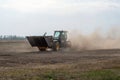 Kropivnitskiy, Ukraine April 20, 2019: The JCB bucket loader in motion at a demonstration site agro exhibition AgroExpo. Tractor