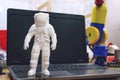 Kropivnitskiy, Ukraine Ã¢â¬â 12 may, 2018: 3D printed astronaut, cosmonaut, robot on the background of devices and laptop. Spaceman