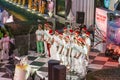 KRVS choir has a Christmas performance in front of a shopping center. Kids are dressed with Christmas hat and people enjoy to