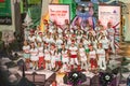 KRVS choir has a Christmas performance in front of a shopping center. Kids are dressed with Christmas hat and people enjoy to