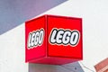 Lego brand name and logo on red cube.